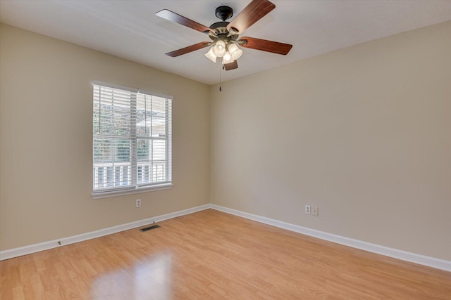 spare room with ceiling fan and light hardwood / wood-style floors