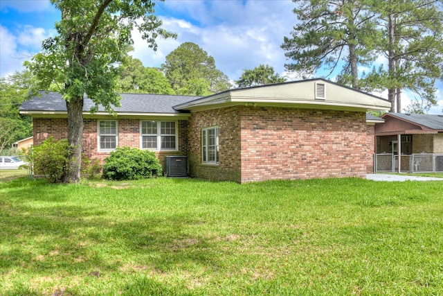 3609 Fairfax Ct, Augusta, GA 30906 - view of home's exterior with brick siding, a yard, and central air condition unit