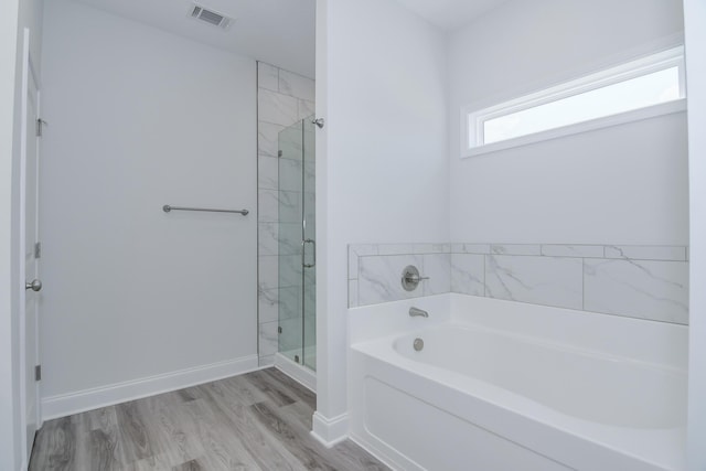 326 Agape Ln, Trenton, SC 29847 - full bath with a garden tub, a stall shower, and wood finished floors