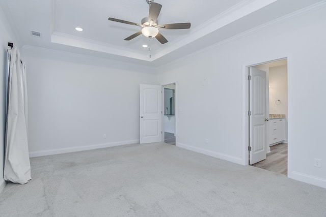 326 Agape Ln, Trenton, SC 29847 - unfurnished bedroom with light colored carpet, crown molding, a raised ceiling, recessed lighting, and connected bathroom