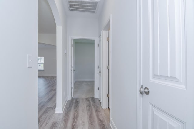 326 Agape Ln, Trenton, SC 29847 - corridor featuring arched walkways and light wood-style flooring