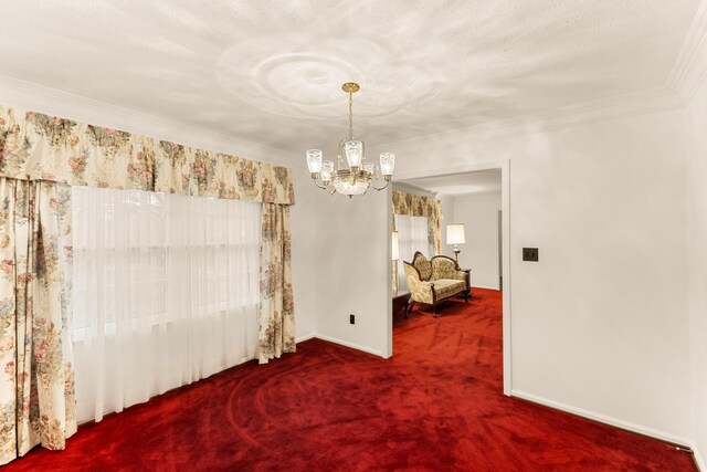 carpeted spare room featuring a textured ceiling, an inviting chandelier, and crown molding