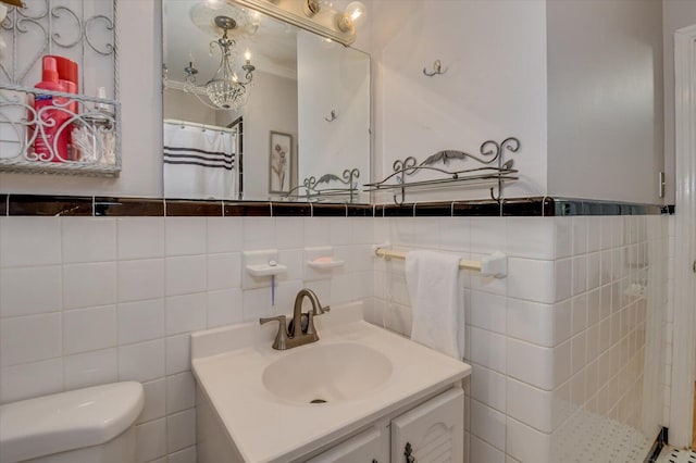 413 Park Dr, Waynesboro, GA 30830 - bathroom featuring toilet, tile walls, and vanity