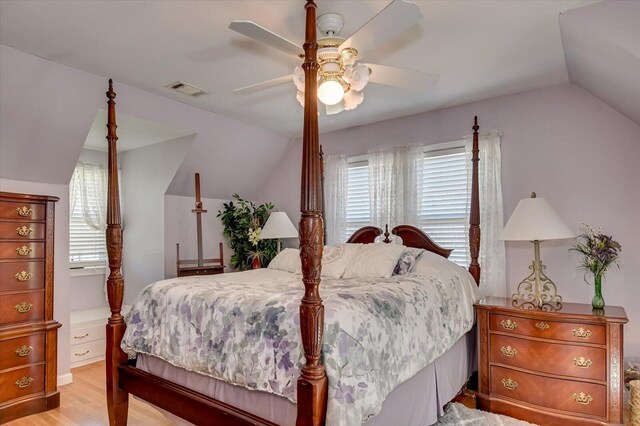413 Park Dr, Waynesboro, GA 30830 - bedroom with light wood finished floors, visible vents, a ceiling fan, and vaulted ceiling