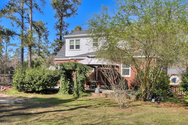 413 Park Dr, Waynesboro, GA 30830 - back of property featuring brick siding, a lawn, and a chimney