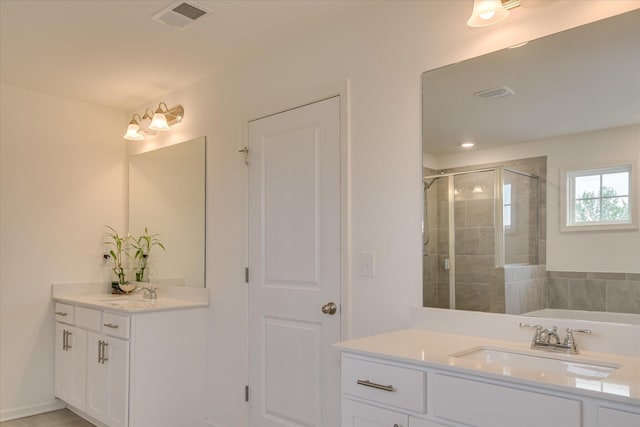 1207 Mary Hill Ct, Evans, GA 30809 - bathroom featuring two vanities, visible vents, a shower stall, and a sink