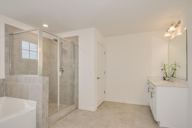 1207 Mary Hill Ct, Evans, GA 30809 - bathroom featuring vanity, baseboards, a garden tub, and a stall shower