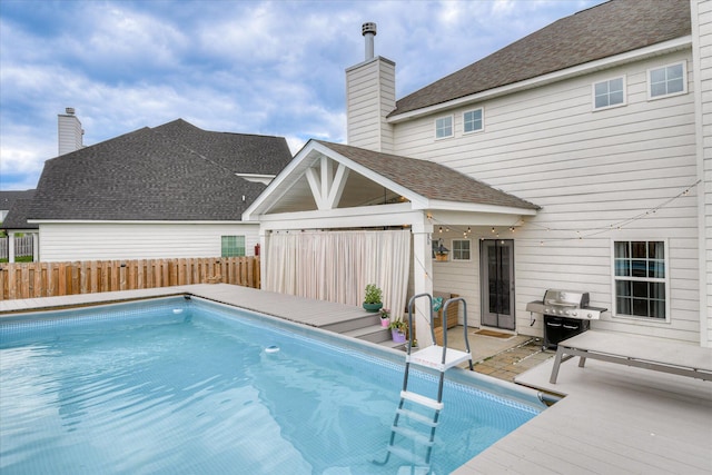 1207 Mary Hill Ct, Evans, GA 30809 - view of swimming pool featuring a deck, a fenced in pool, fence, and a grill