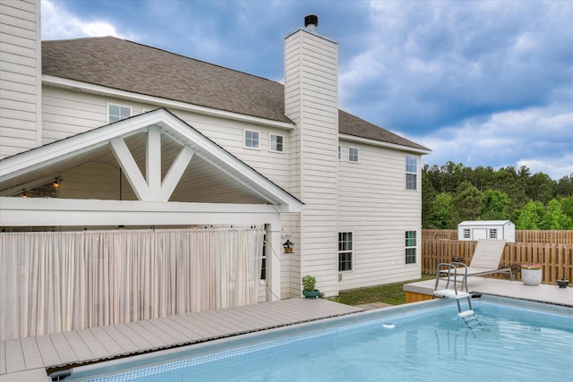 1207 Mary Hill Ct, Evans, GA 30809 - view of pool with a fenced in pool, an outdoor structure, fence, and a storage unit