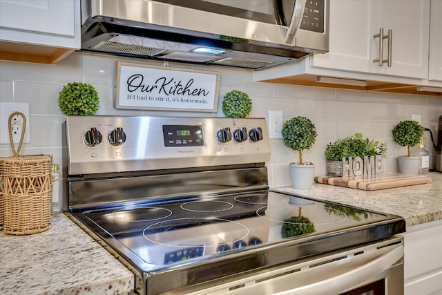 1207 Mary Hill Ct, Evans, GA 30809 - details with appliances with stainless steel finishes, tasteful backsplash, light stone countertops, and white cabinets