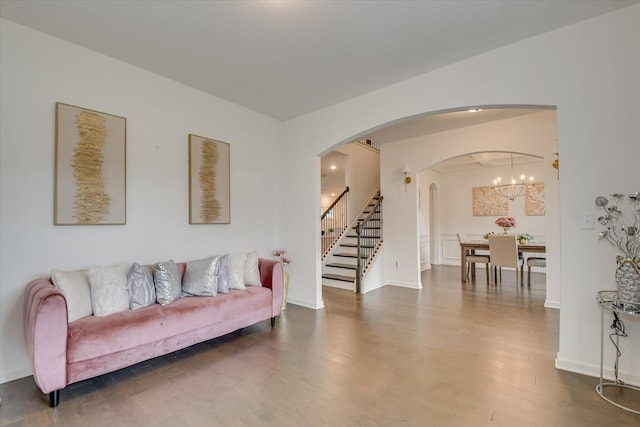 1207 Mary Hill Ct, Evans, GA 30809 - living room featuring stairway, arched walkways, baseboards, and wood finished floors