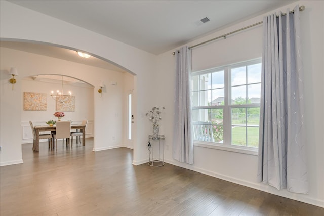 1207 Mary Hill Ct, Evans, GA 30809 - unfurnished room with arched walkways, baseboards, dark wood finished floors, and visible vents