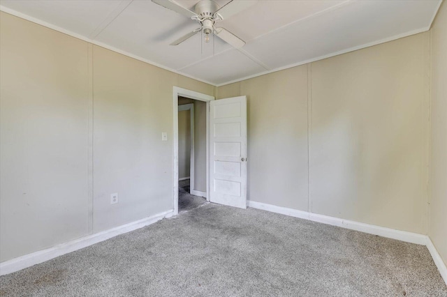 unfurnished room featuring carpet and ceiling fan