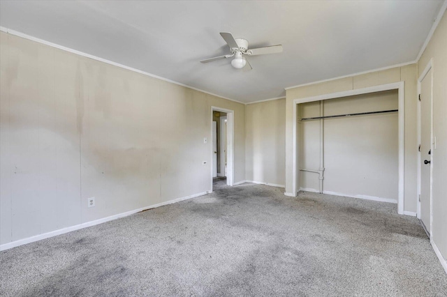 unfurnished bedroom with carpet flooring, a closet, ceiling fan, and crown molding