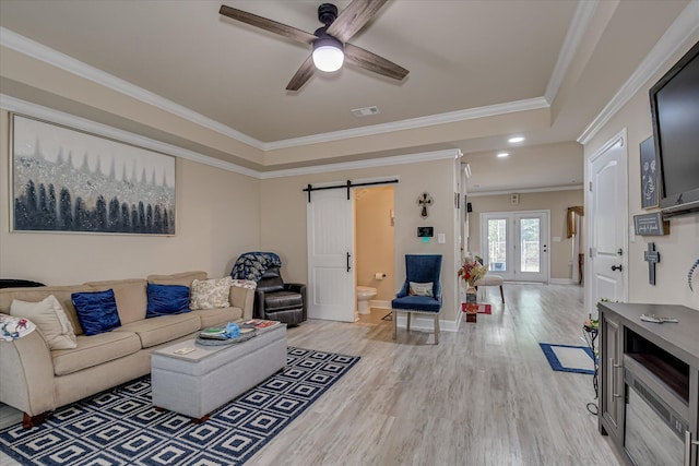 1222 Jessie Way, Augusta, GA 30906 - living area with ceiling fan, light wood-type flooring, a barn door, baseboards, and ornamental molding