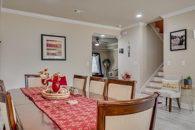 1222 Jessie Way, Augusta, GA 30906 - dining room featuring visible vents, crown molding, ceiling fan, stairway, and light wood finished floors