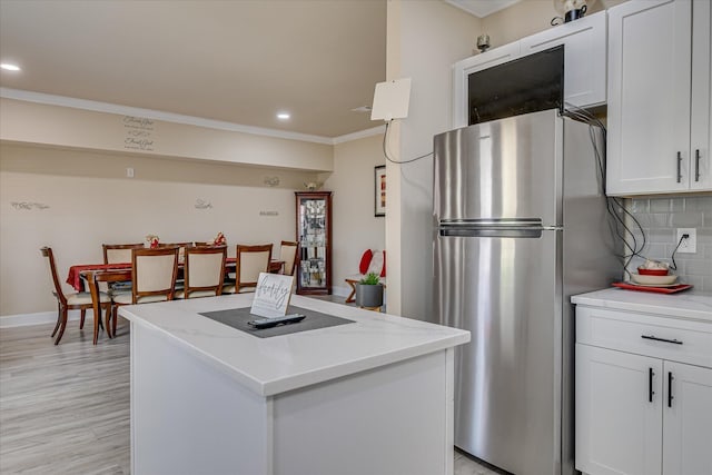 1222 Jessie Way, Augusta, GA 30906 - kitchen with freestanding refrigerator, recessed lighting, crown molding, and a center island