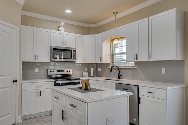 1222 Jessie Way, Augusta, GA 30906 - kitchen featuring backsplash, stainless steel appliances, white cabinetry, and a sink