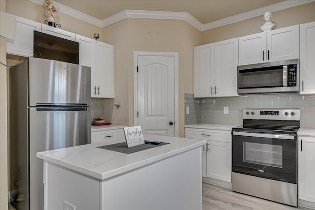 1222 Jessie Way, Augusta, GA 30906 - kitchen featuring crown molding, white cabinetry, backsplash, and stainless steel appliances