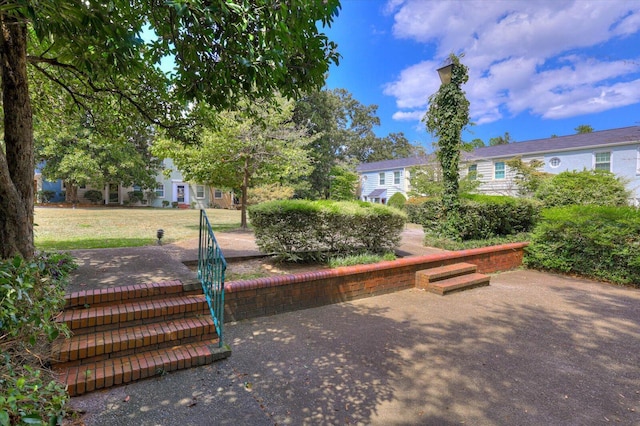 view of property's community with a patio area