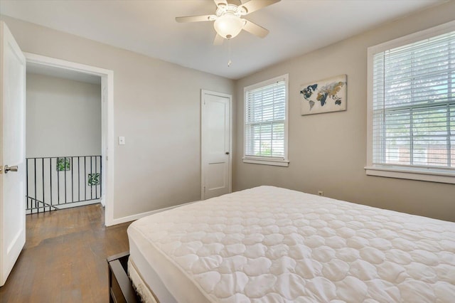 bedroom featuring hardwood / wood-style flooring and ceiling fan