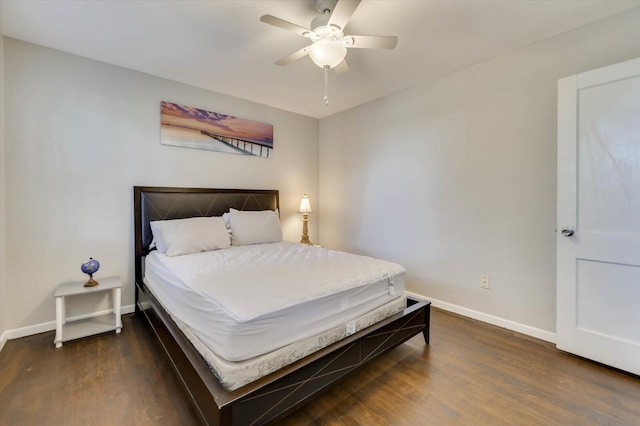 bedroom featuring dark hardwood / wood-style flooring and ceiling fan