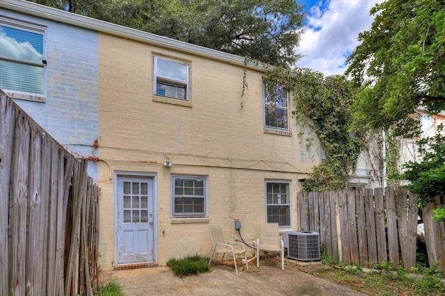 back of house with cooling unit