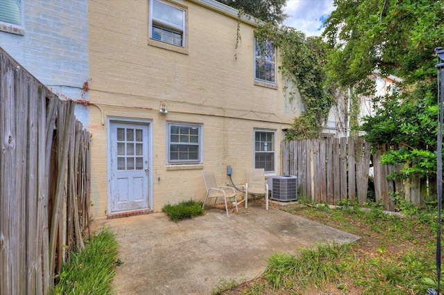 back of property with a patio and cooling unit