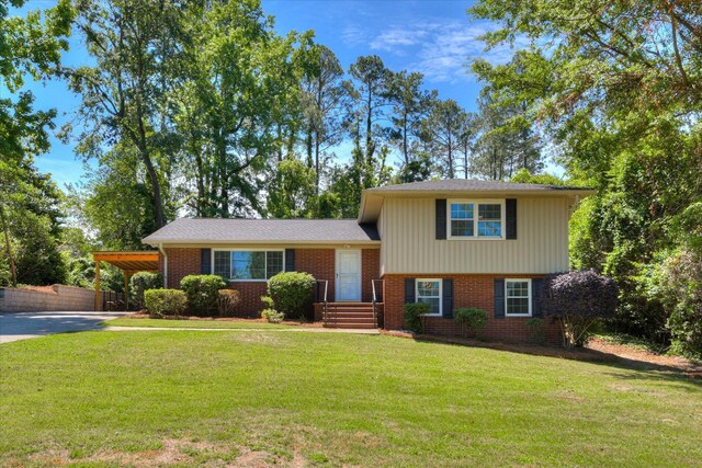813 Hammond Dr, North Augusta, SC 29841 - tri-level home with an attached carport, brick siding, and driveway
