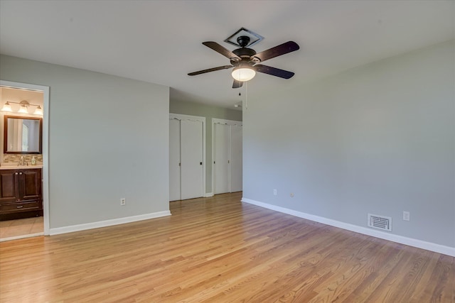 813 Hammond Dr, North Augusta, SC 29841 - unfurnished bedroom featuring light wood-style floors, baseboards, and multiple closets