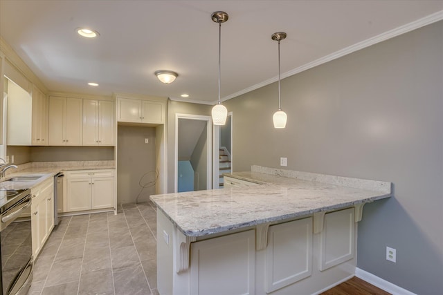 813 Hammond Dr, North Augusta, SC 29841 - kitchen featuring a peninsula, appliances with stainless steel finishes, light stone counters, crown molding, and pendant lighting