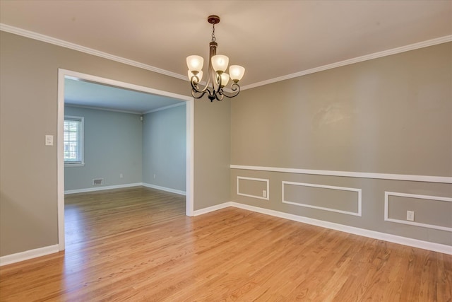 813 Hammond Dr, North Augusta, SC 29841 - unfurnished room featuring a chandelier, crown molding, light wood-type flooring, and baseboards