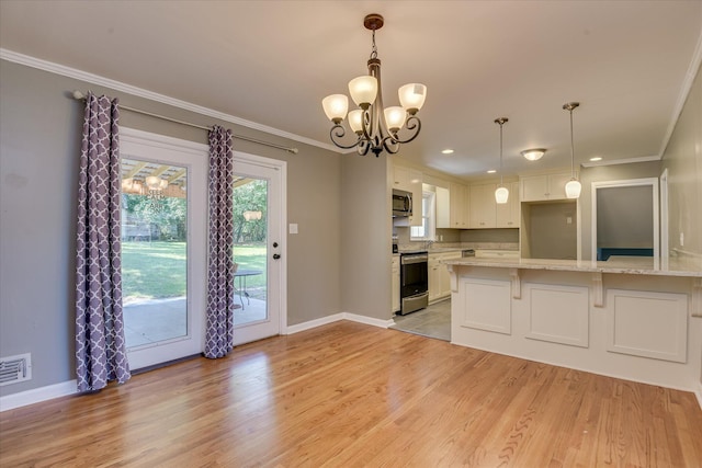 813 Hammond Dr, North Augusta, SC 29841 - kitchen featuring appliances with stainless steel finishes, a chandelier, ornamental molding, white cabinetry, and light wood-type flooring