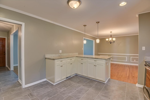 813 Hammond Dr, North Augusta, SC 29841 - kitchen featuring white cabinetry, crown molding, a chandelier, a peninsula, and light stone countertops