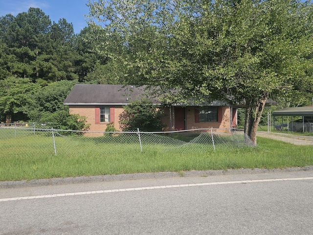 view of front facade with a carport