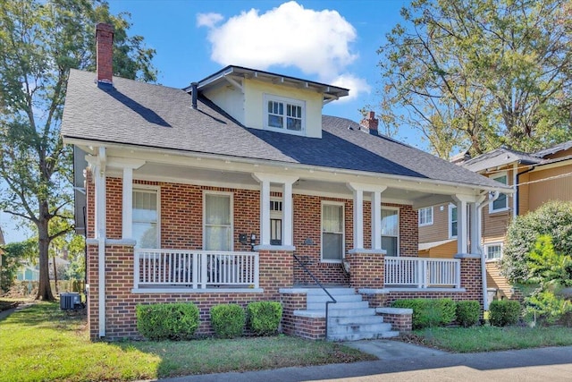 view of front of home featuring a porch and cooling unit