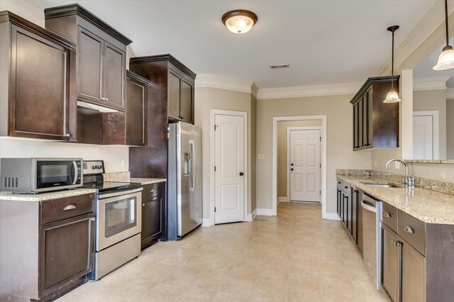 kitchen featuring sink, hanging light fixtures, dark brown cabinets, appliances with stainless steel finishes, and ornamental molding