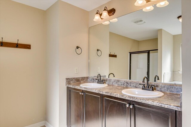 bathroom with vanity and an enclosed shower