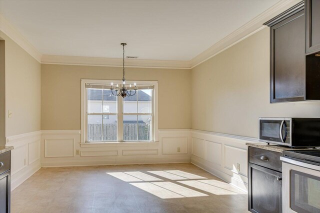 unfurnished dining area with crown molding and a notable chandelier