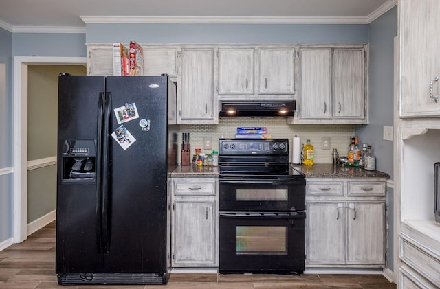 kitchen with crown molding, decorative backsplash, range hood, black appliances, and wood finished floors