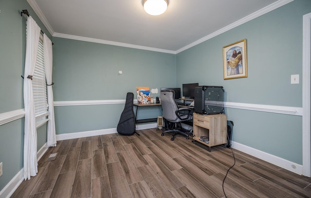 office area with baseboards, crown molding, and wood finished floors