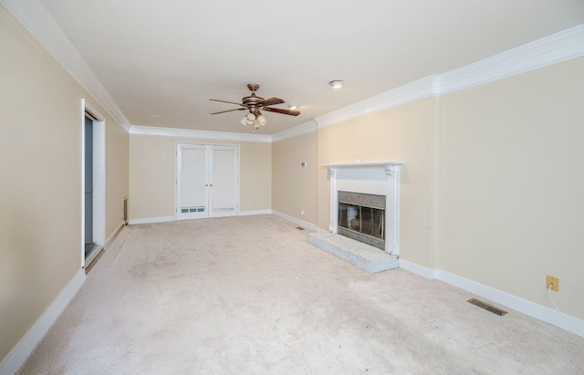 unfurnished living room featuring a fireplace, visible vents, crown molding, and ceiling fan