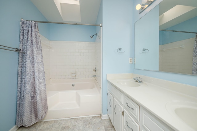 full bathroom featuring shower / bath combo, double vanity, and a sink