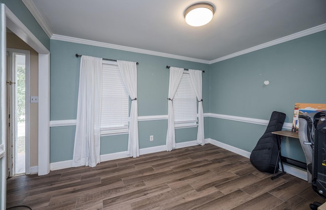 office space featuring crown molding, baseboards, and dark wood finished floors