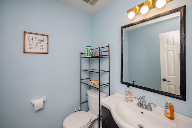 bathroom with visible vents, a sink, and toilet