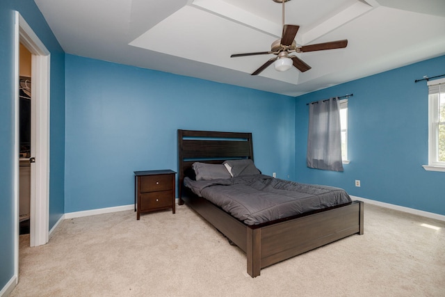 carpeted bedroom featuring baseboards and ceiling fan