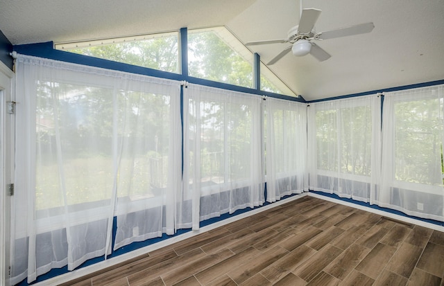 unfurnished sunroom with a ceiling fan