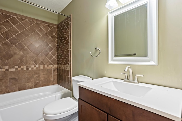 full bathroom with vanity, toilet, and tiled shower / bath