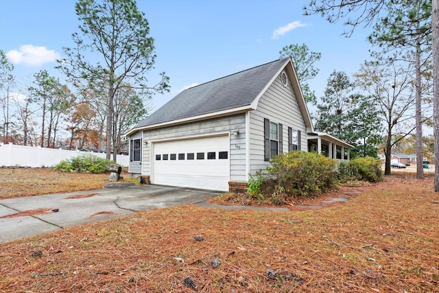 view of side of home with a garage