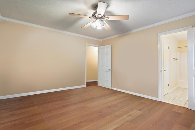 unfurnished bedroom featuring a textured ceiling, ceiling fan, light wood-type flooring, and crown molding